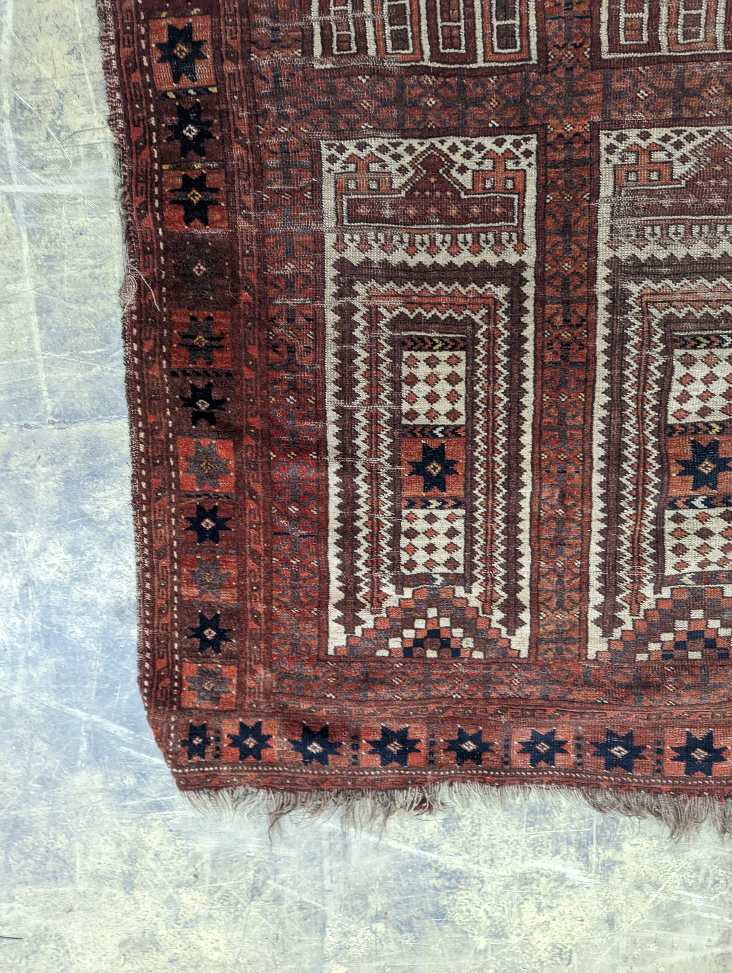 An Afghan red ground prayer rug, 166 x 120cm